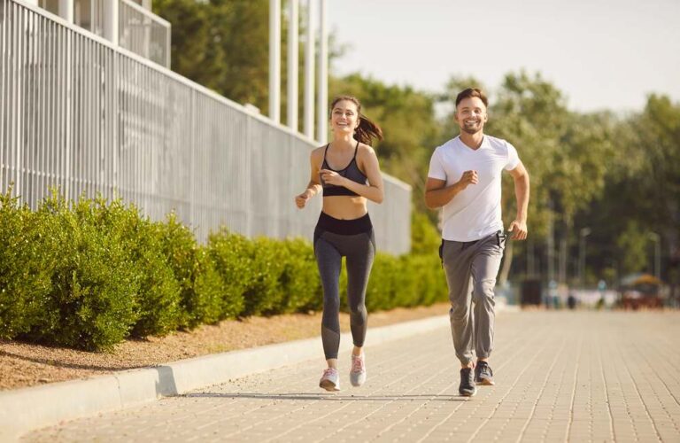 a man and a woman jogging together with smiley face