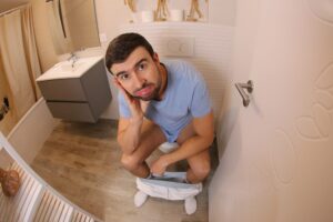 a man sitting on the toilet